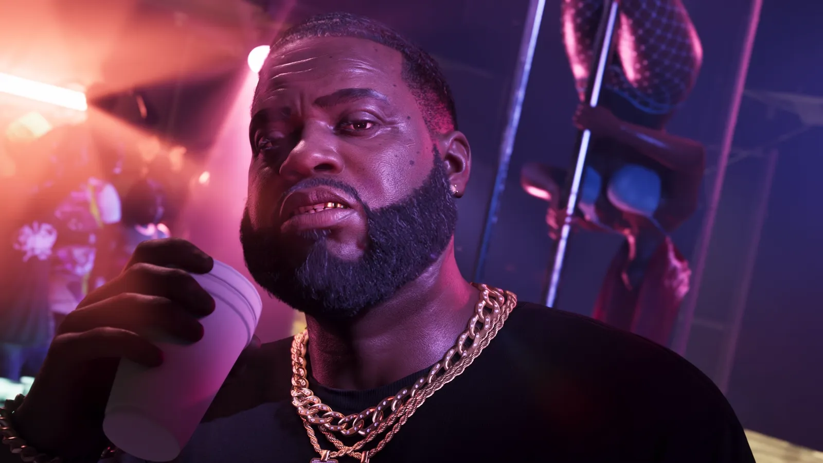 Boobie in a club holding a drink.