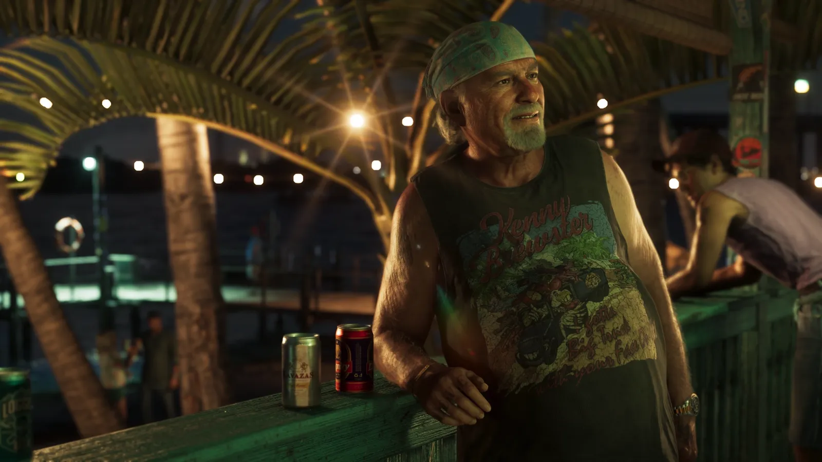 Brian at a bar railing at night with two cans in front of him.