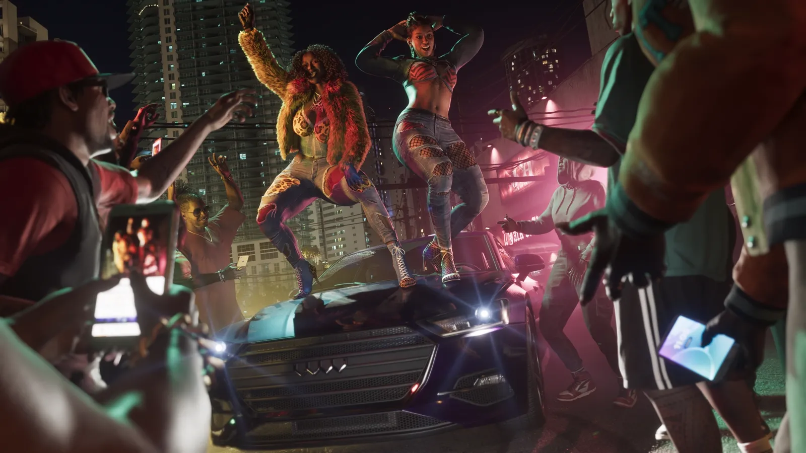 The Real Dimez dancing on the hood of a car while a crowd films them.
