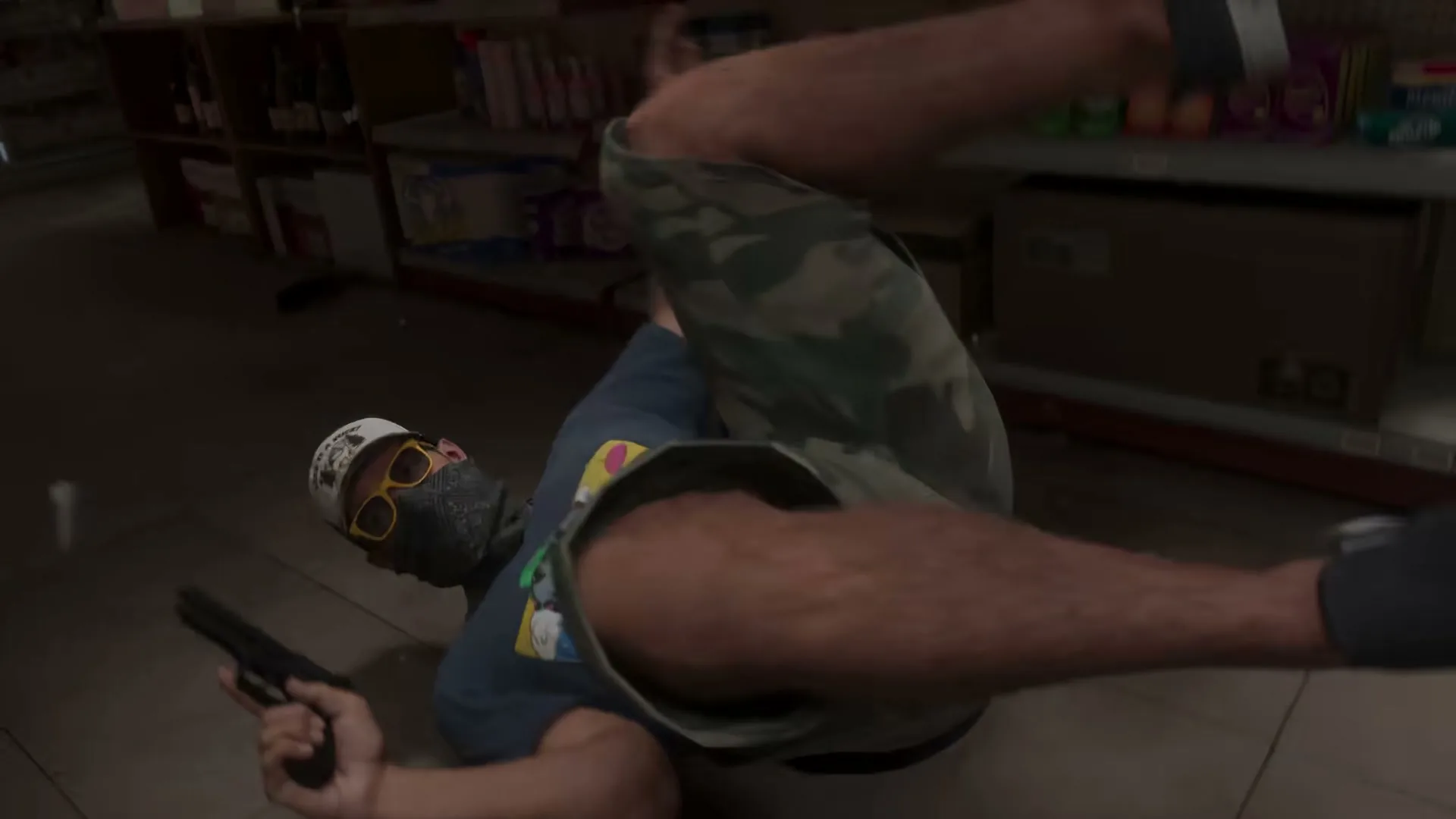 A store clerk tackling Jason to the floor mid-robbery, his pistol still in hand.
