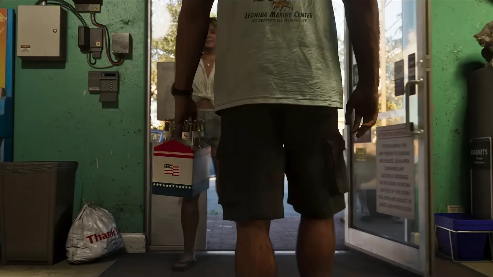 A customer in the doorway of a corner store, an ATM against the wall, from Trailer 2.