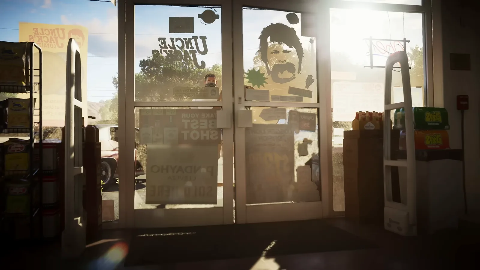The glass front doors of a convenience store seen from inside, from Trailer 1.